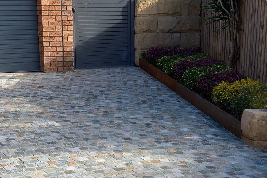 Framing Your Landscape: Why Travertine Cobblestones Elevate Curb Appeal