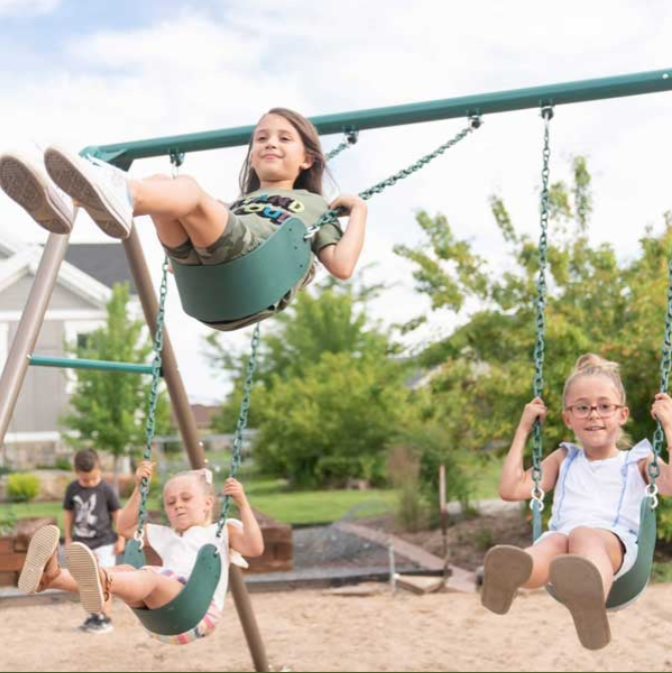 What Sets a Lifetime Deluxe Swing Set Apart From Wooden Playset Options