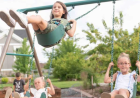 What Sets a Lifetime Deluxe Swing Set Apart From Wooden Playset Options